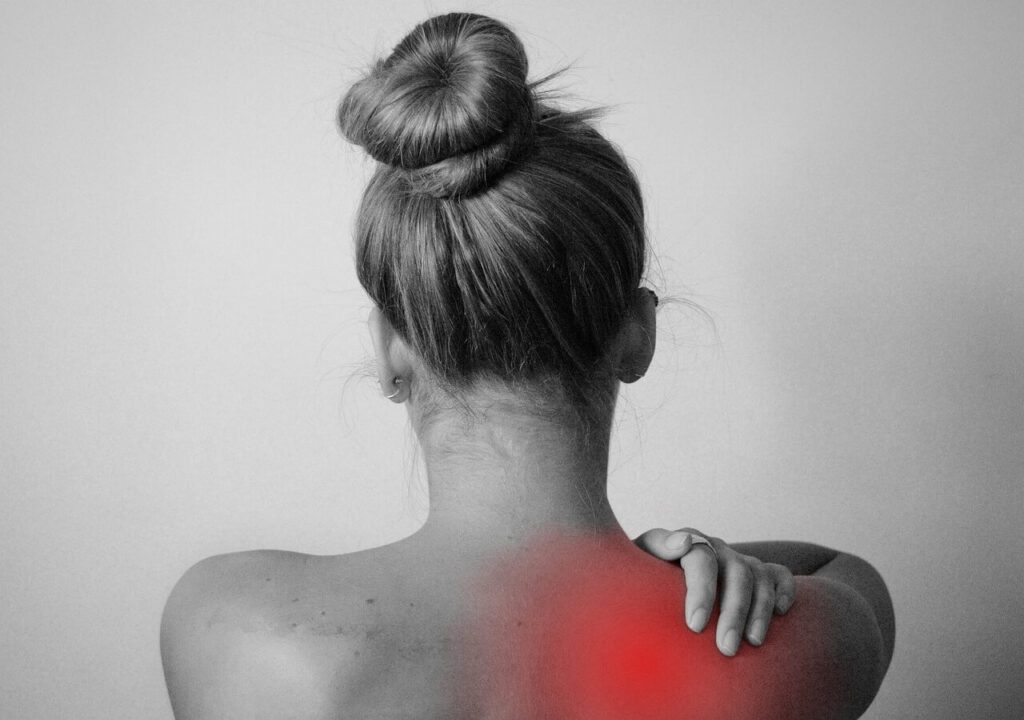 Image of a woman suffering from back pain